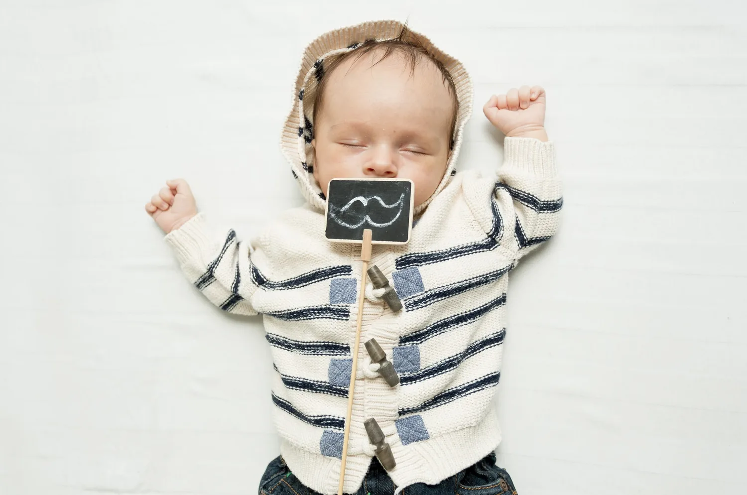 Photographie de naissance poétique et portrait de famille par Greg Photographe